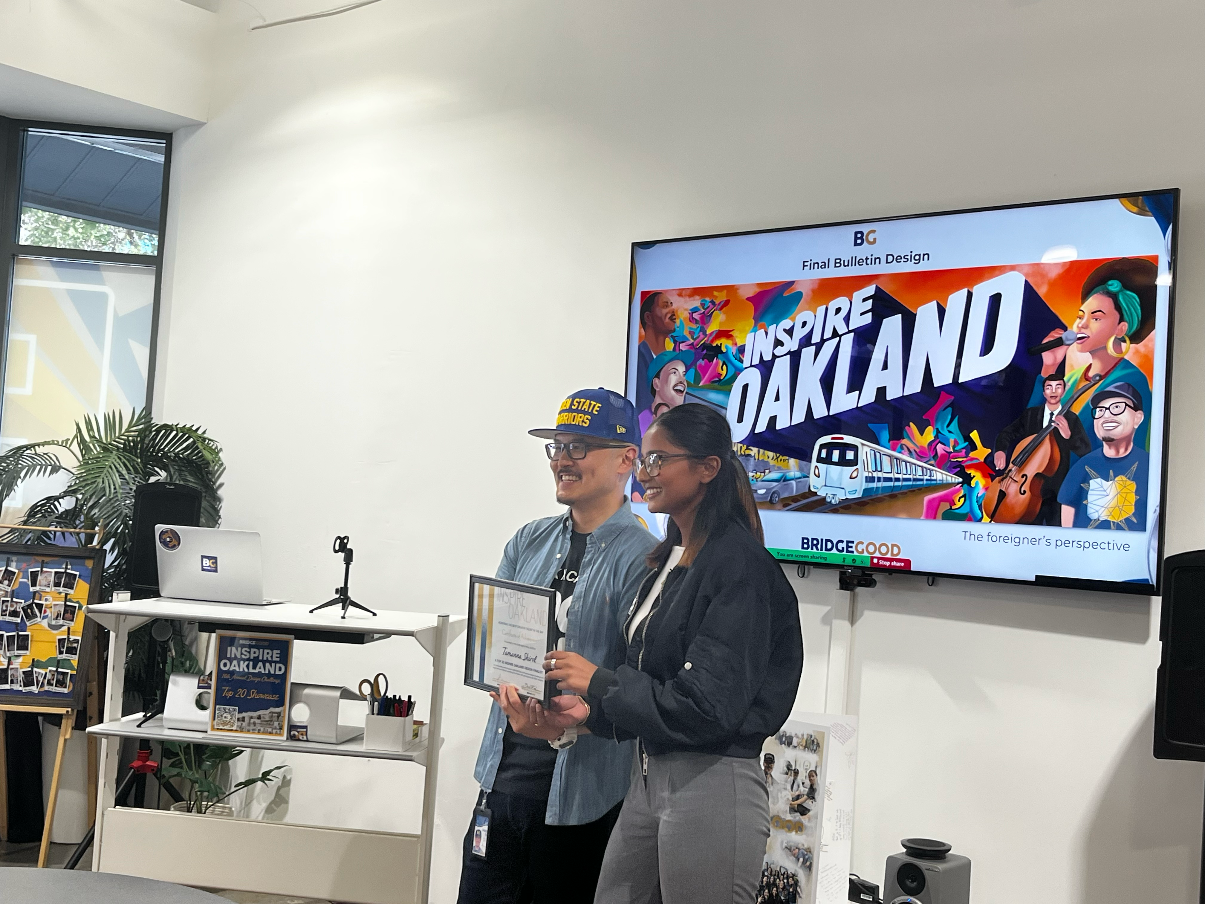 Shaun giving tamanna the certificate