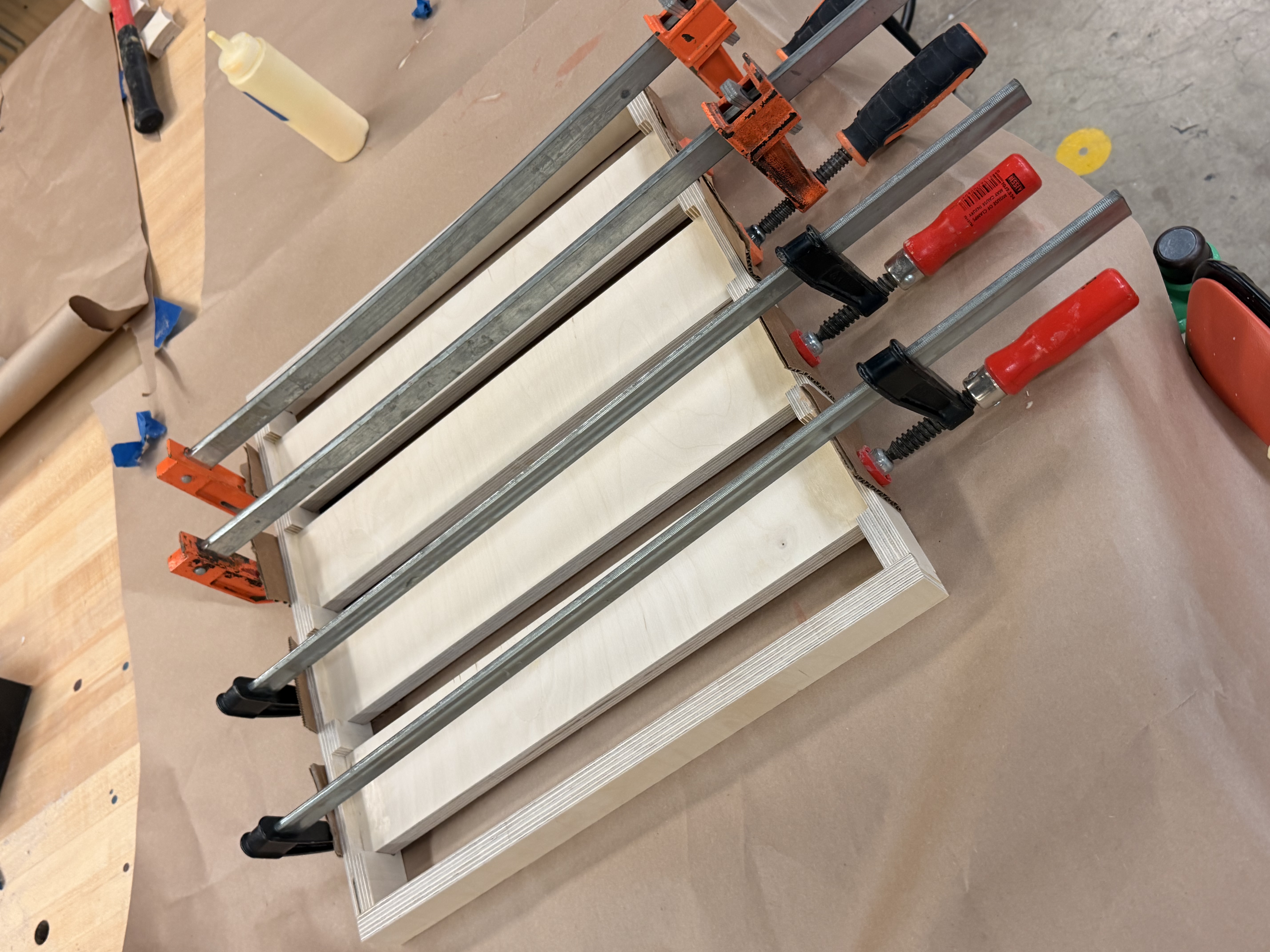 Seat slats being glued and clamped flat