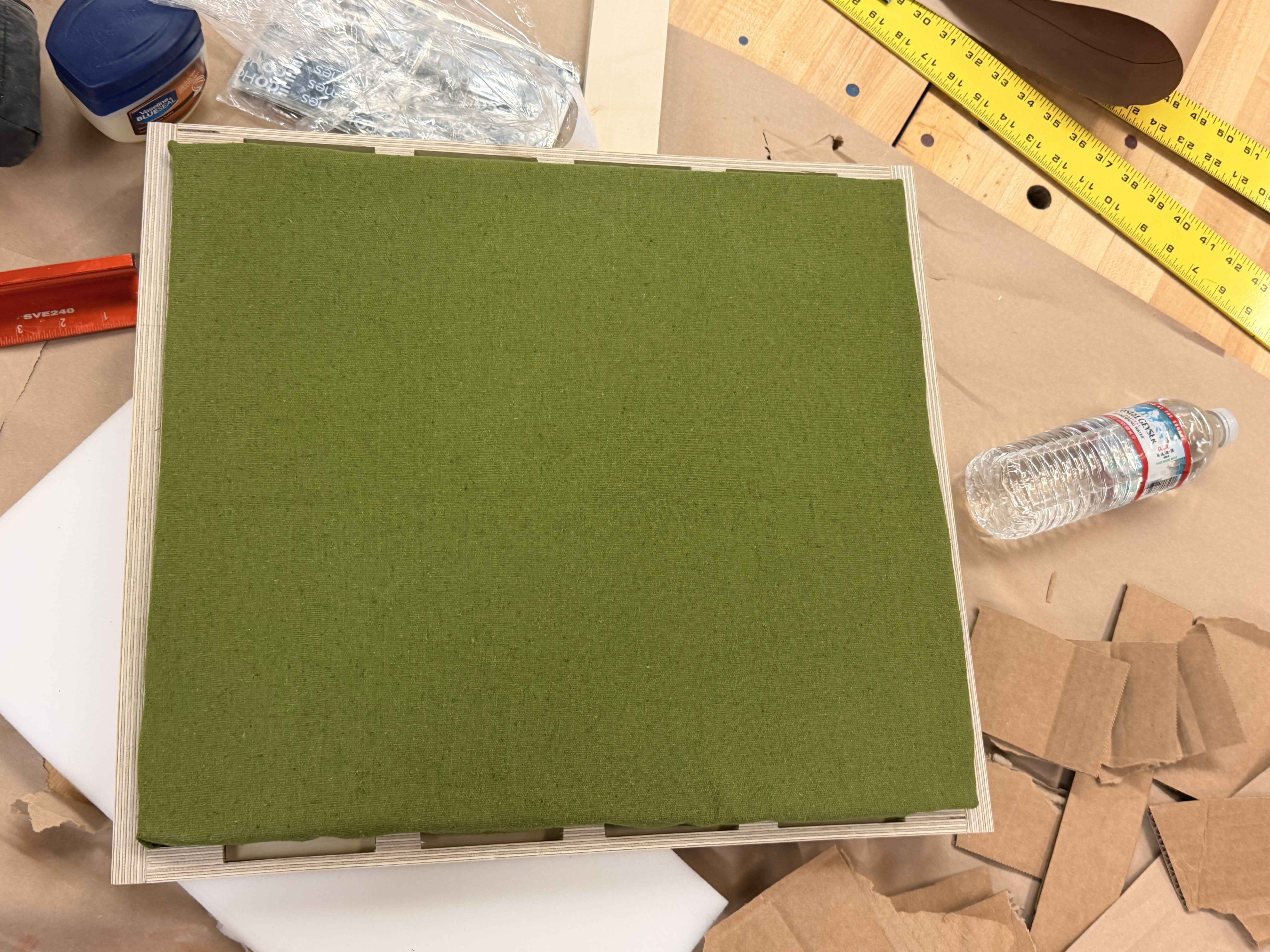 Foam and green fabric cushion construction