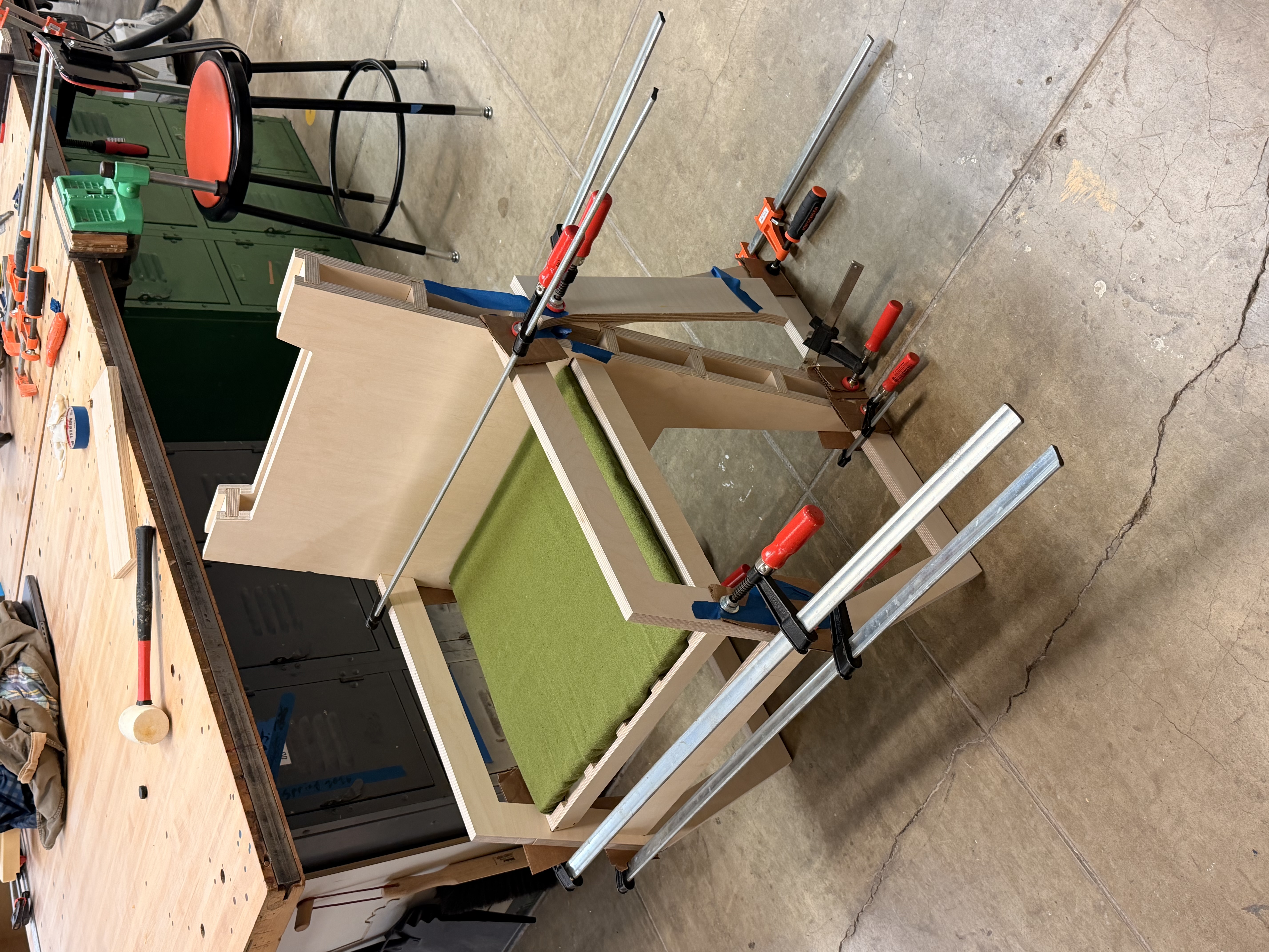 Chair clamped during glue-up with green cushion